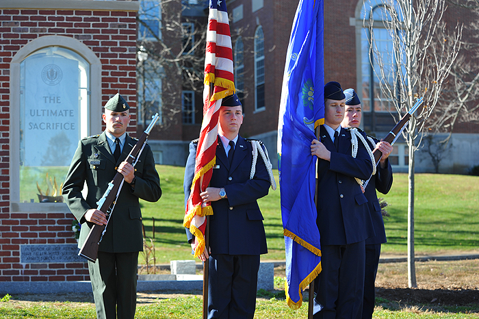 <p>The honor guard retires the colors at the end of the Veteran's Day ceremony held on the lawn in front of the Wilbur Cross Building. Photo by Peter Morenus</p>