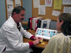 Dr. Bob Kravecs with dental student Jennifer Jaskolka. (Jennifer Huber/UConn Health Center Photo)