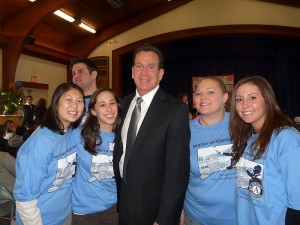 AmeriCorps members with the governor. From left to right are Anna Chang, Sara Servin, Jennifer Sweat, and Erin Royer. (Celia Tvrdik for UConn Health Center)