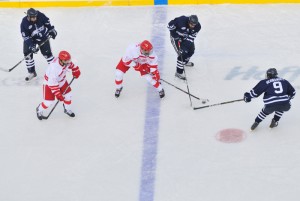 <p>Players vie for the puck during the men's game against Sacred Heart University held at Rentschler Field.  UConn won 3-1. Photo by Peter Morenus.</p>