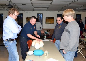 Eric Colantonio providing instruction to AVFD Capt. Chris Kunzelmann (left) and AVFD Firefighters Jim Speich (back, right) and Jeff Petersen (front, right). (Laura Phillips Ward for UConn Health Center)