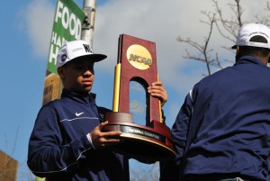 <p>Freshman Shabazz Napier shows off the NCAA championship trophy. Photo by Peter Morenus.</p>