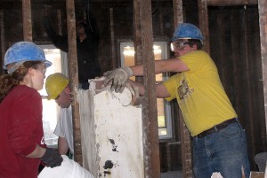 <p> (L to R) Jennifer Carpenter, from Storrs, worked with Adam Pierce and Noah Griffin, both from Avery Point, in a first floor demolition at one of the ‘remodel’ sites.  Education is one of the critical components of a spring break and student volunteers were required to attend four pre-trip meetings to help them understand the reason for their service-learning experience.</p>