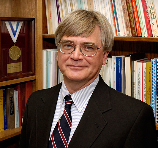 <p>Victor Hesselbrock, Ph.D., professor of psychology at his office at the UConn Health Center. Photo by Peter Morenus</p>