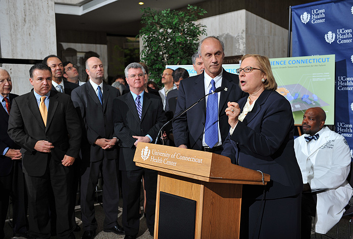 <p>State Rep. Bill Wadsworth (R- Farmington), center, and State Senator Terry Gerratana (D-New Britain), right, speak at a press conference held at the UConn Health Center to announce Bioscience Connecticut on May 17, 2011. Photo by Peter Morenus</p>