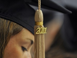 <p>An MBA student's 2011 tassel at the graduate commencement ceremony held at Gampel Pavilion. Photo by Peter Morenus</p>