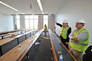 <p>John Warner of architectural and engineering services, right, leads Jeff von Munkwitz-Smith, university registrar, and other members of the registrar's staff on a tour of the West Classroom Building. </p>