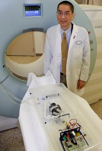 Dr. Clifford Yang is the creator of a device that simulates a beating heart for use in training technologists in cardiac imaging. (Chris DeFrancesco/UConn Health Center Photo)