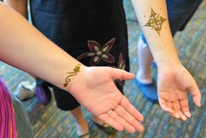 Students display tattoos on their wrists.