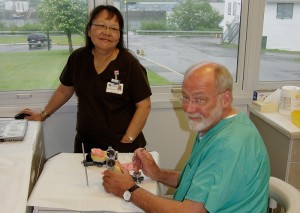 Dr. Thomas Taylor with a dental assistant preparing to fit a patient with new dentures during the outreach trip in Sitka, Alaska, on June 17, 2011. (Photo provided by Dr. Thomas Taylor)