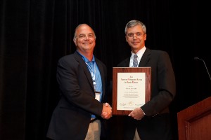 Dr. Robert Arciero (left) accepts the George D. Rovere Award for excellence in peer education from Dr. Andrew Cosagrea of the American Orthopaedic Society for Sports Medicine on July 8, 2011. (Garrett Hacking forAmerican Orthopaedic Society for Sports Medicine)