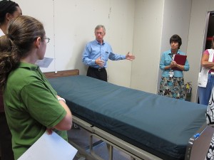 Neil Alcorn with SBA/HKS Architects answers questions about the patient room mock-up. (Jennifer Beardsley/UConn Health Center Photo)