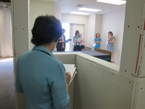 Nursing manager Donna Pryor fills out an evaluation form about the patient room mock-up. (Jennifer Beardsley/UConn Health Center Photo)