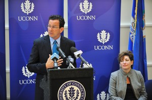 Governor Dannel P. Malloy speaks at the dedication ceremony for the new Classroom Building. Seated at right is President Susan Herbst.
