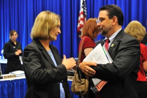 Mary Holz-Clause, left, vice president for economic development, speaks with Steven Reviczky, state commissioner of agriculture.