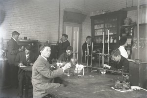 A science class uses microscopes in a lab in 1908.