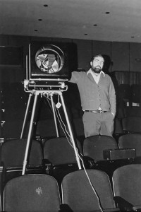 Louis Cendette operates a video projector in 1974. (UConn Health Center Archive)