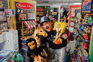 Doug Bernstein '85 (CLAS) poses with many Melissa &amp; Doug toys. (Peter Morenus/UConn Photo)