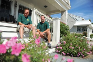 Harlan Hyde '99 (RHSA) and Brandon Hyde '01 (CANR) of Hyde Park Landscaping show their work at a beachfront house in Groton Long Point.  (Peter Morenus/UConn Photo)