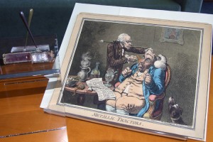 British caricaturist and printmaker James Gilray’s farcical portrayal of a physician using metallic tractors on a patient is featured as a comical piece in the Hartford Medical Society Historical Library’s newest exhibit at the UConn Health Center.