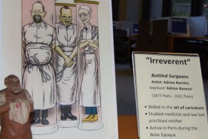 Under the category of “irreverent,” French caricaturist Adrien Barrère’s “Bottled Surgeons” is among the artwork on display in the Health Center’s L.M. Stowe Library.