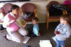 Connections coordinator Jennifer Vendetti (left) reads with toddlers at a recent Nurturing Families Network group program. (Photo provided by Jennifer Vendetti)