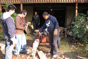 Kim Panther, right, a junior with a double major in chemistry and actuarial science, helps clean up storm debris in Storrs to raise money for the Costa Rica trip. (LSAMP Photo)