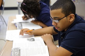 Eighth-graders in Kara Ledger's class read about and discuss the conditions experienced by Union and Confederate soldiers. (Peter Morenus/UConn Photo)
