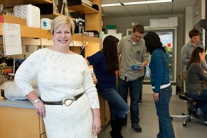Molecular and cell biology professor Carolyn Teschke, foreground, with her research group. (Daniel Buttrey/UConn Photo)