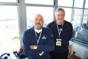 Joe D'Ambrosio, left, and Wayne Norman, in the WTIC/UConn Radio Network booth high above Rentschler Field. (Kenneth Best/UConn Photo)