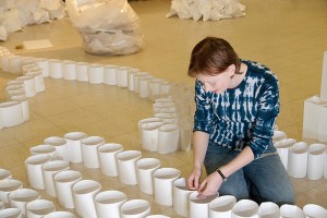 Kaitrin Acuna '15 (SFA) builds her paper sculpture. (Sarah Rawlinson/UConn Photo)