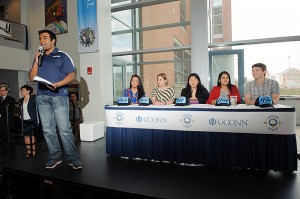 Vijay Sekhara '12 (ENG), master of ceremonies, introduces the judges, from left, Maria McCool '12 (CLAS), Catlin Davies '12 (CLAS), Cindy Luo '12 (CLAS), Nasreen Mustafa '12 (CLAS), and Ethan Butler '12 (ENG), at an event held at the Student Union food court  to select the 2012 Senior Scoop ice cream flavor on Feb. 17. (Peter Morenus/UConn Photo)