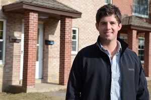 Recent graduate Stephen Fortin outside Mansfield Apartments, where he established a composting project. (Ariel Dowski '14 (CLAS)/UConn Photo)