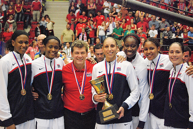 Geno and UConn players with medals.