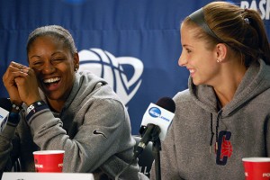 Tiffany Hayes '12 (CLAS) and Caroline Doty '13 (CLAS) share a laugh during the press conference for the NCAA Tournament in Kingston, R.I. (Ken Best/UConn Photo)