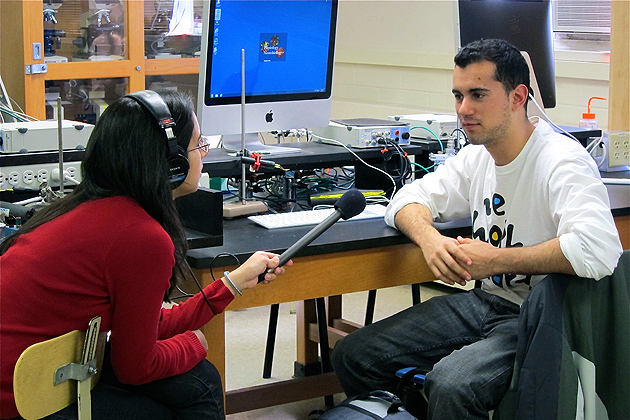 WNPR radio reporter Neena Satija interviews student Alex Gomes about the human psysiology laboratory. (Christine Buckley/UConn photo)