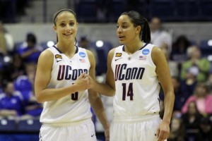 Caroline Doty '13 (CLAS) and Bria Hartley '14 (CLAS) celebrate the Huskies '77-59 NCAA Tournament win over Penn State Sunday afternoon at the Ryan Center in Kingston, R.I. (Bob Stowell/UConn Photo)