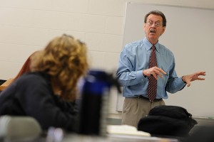 Marcel Dufresne, associate professor of journalism, speaks with students in his investigative reporting class. (Peter Morenus/UConn Photo)