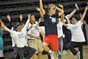 UConn student and basketball player Caroline Doty leads Read & raise participants in yoga exercises. (Shawn Kornegay/UConn Photo)