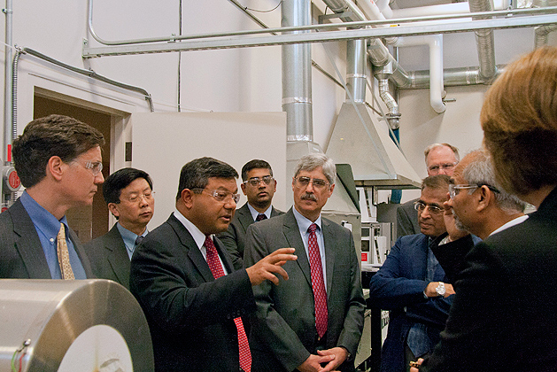 Arun Majumdar, acting under secretary of energy in the US Department of Energy toured UConn's Center for Clean Energy Engineering at the Depot Campus. He was accompanied by Daniel Esty (far left), commissioner of the Conn Department of Energy and Environmental Protection. (Orlando Echevarria/UConn Photo)
