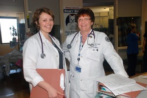Nurse Jamie Hinchliff (left) and nurse practitioner Marlene Culley, a 2012 Nightingale Award recipient, work in the UConn Health Center's intensive care unit. (Janine Gelineau/UConn Health Center Photo)