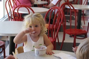Emily, from Bristol, is about to turn two years old. She was enjoying some pre-birthday ice cream at the Dairy Bar with her grandparents. She  didn't have anything to say about extended hours, but a picture really is worth a 1,000 words. (Sheila Foran/UConn Photo)