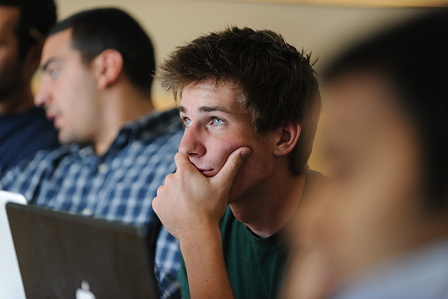 Tom Bachant '13 (ENG) listens to a mentor during an inQbator training session. (Peter Morenus/UConn Photo)