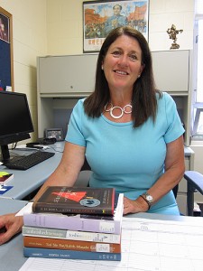 Christine Reardon in her office at the Torrington campus with books about East Asia. (Cindy Weiss/UConn Photo)