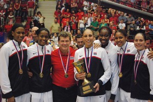 Six former Huskies and head coach Geno Auriemma are part of the 2012 U.S. Olympic Women's Basketball Team competing in London this month. From left: Asjha Jones, Swin Cash, Coach Auriemma, Diana Taurasi, Tina Charles, Maya Moore, and Sue Bird. (Photo courtesy of USA Basketball)