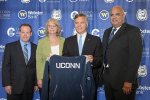 Rex Hough, regional vice president of IMG Campus, left, Lisa Lewis, executive director of the UConn Alumni Association, Jerry Plush, president and CEO of Webster Bank, and Warde Manuel, UConn's director of athletics, at an event held at Centennial Alumni House to announce a major agreement to make Webster Bank "The Official Bank of UConn" on July 26, 2012. (Peter Morenus/UConn Photo)