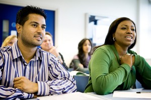 A pair of adult learners engaged in a lesson. (iStock Photo)