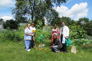 Burgdorf nurses and DHHS staff help tend and organize the crops in front of the garden. (Photo provided by Bruce Gould)