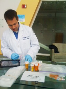 A pharmacy resident handles some of the take. (Photo provided by John Dobbins) 