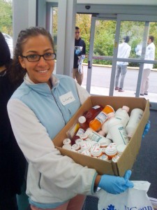 A nursing student carries containers of prescription drugs. (Photo provided by John Dobbins)